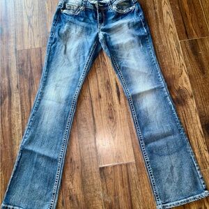 Like new pair of Shyanne jeans with rhinestones on the pockets
